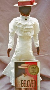 Toni Morrison's Beloved posing with book cover by Omnidoll 1996. Photo by Omnidoll 1996.