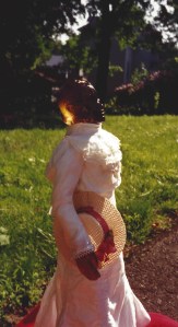 Toni Morrison's Beloved in yard holding hat by Omnidoll 1996. Photo by Omnidoll 1996.