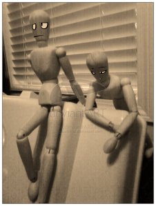 Two wooden artist mannequins relaxing together, with bored facial features superimposed on the photo. From http://bluebead.deviantart.com/art/Mannequin-003-Chill-n-69577475.