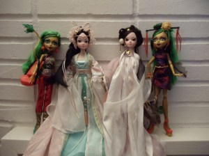 L to R: Mattel Monster High Scaremester "Jinafire Long" Dragon Character (2014),  Kurhn "Dragon Fairy Princess (Goddess)" ~2008, Kurhn "White Snake Fairy" ~2008, Mattel "Scaris City of Frights Jinafire Long" (2013).